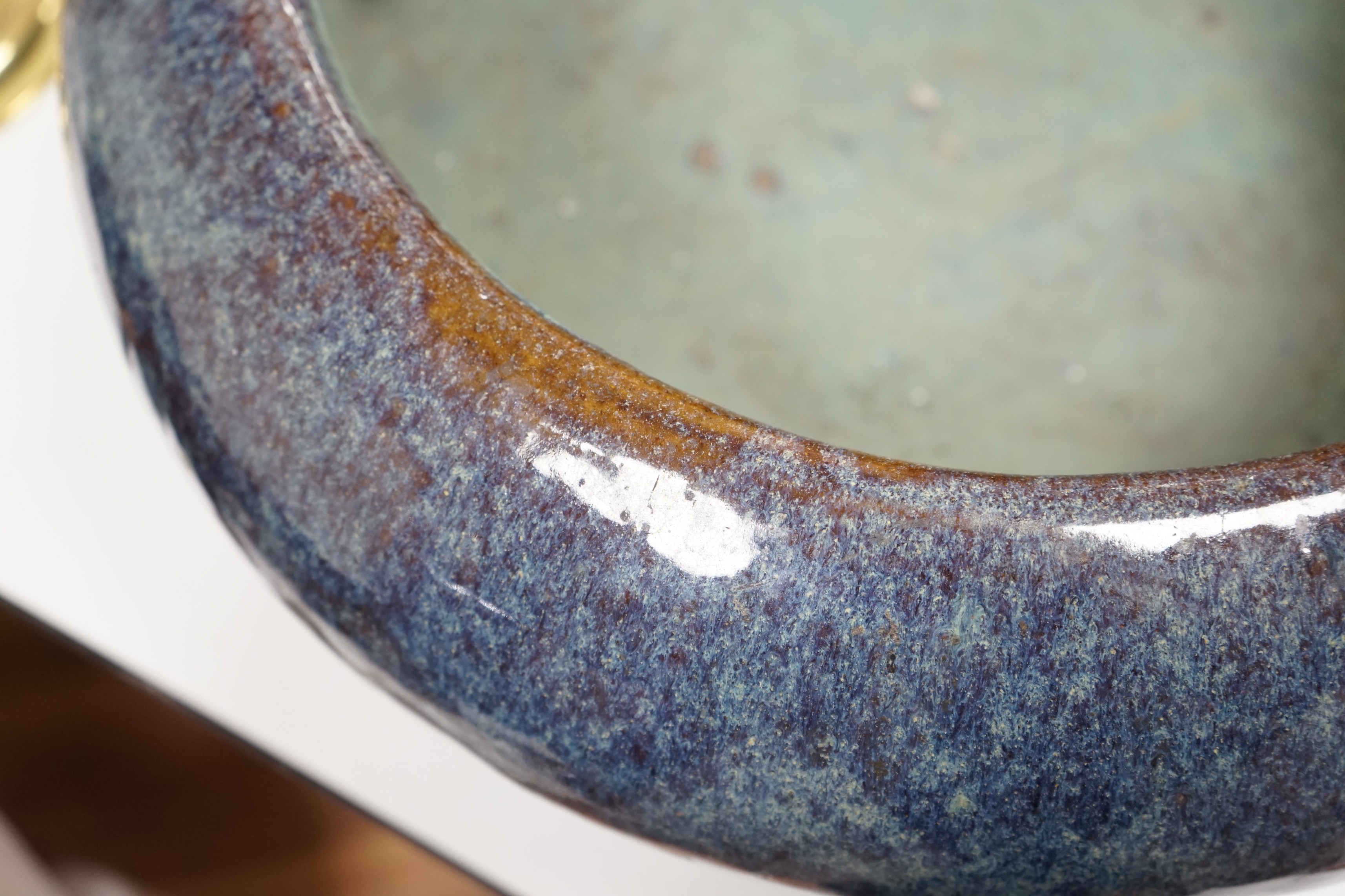 A large Chinese Shiwan stoneware tripod vessel or censer, late 19/early 20th century, 47cm diameter